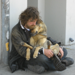 homeless man with his pet dog