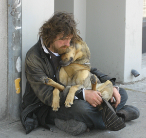 homeless man with his pet dog